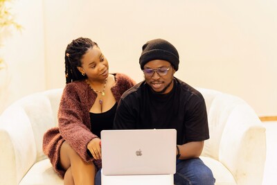 couple sitting at laptop